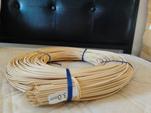 Load image into Gallery viewer, 1 kg coil of 3.0 mm round rattan core tied with blue straps, labelled 3.0mm